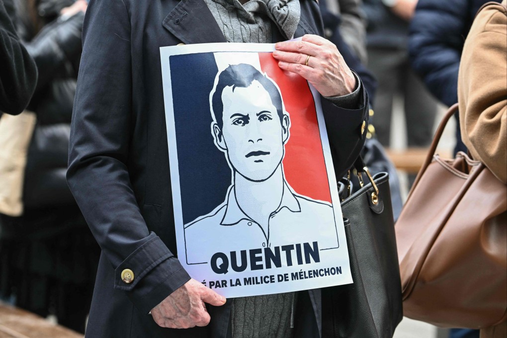 A protester holds a placard during a rally in Strasbourg, France on Sunday in tribute to far-right activist Quentin Deranque, who died last week after being attacked in Lyon. Photo: AFP