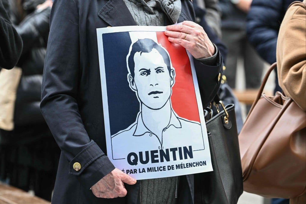 A protester holds a placard during a rally in Strasbourg, France on Sunday in tribute to far-right activist Quentin Deranque, who died last week after being attacked in Lyon. Photo: AFP