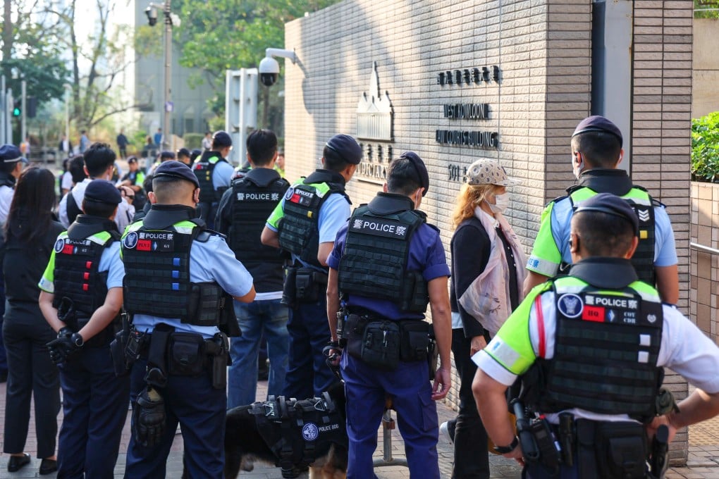 Police officers stand guard outside West Kowloon Court. Photo: Dickson Lee