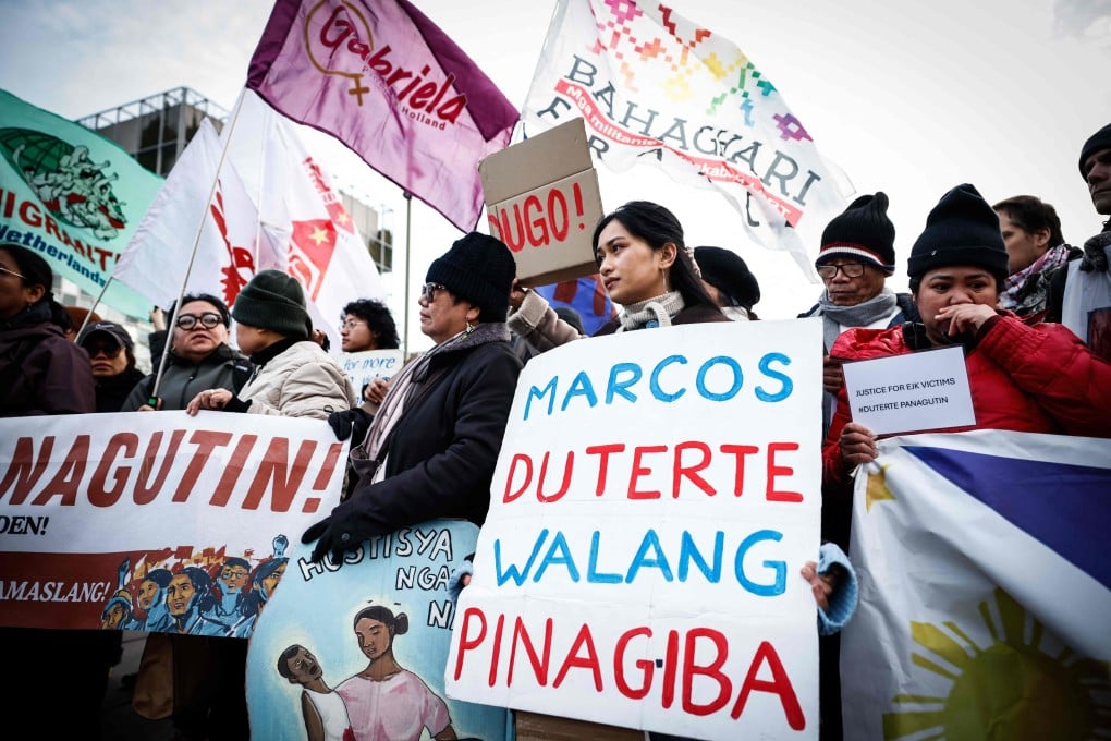 People protest in favour of the detention of former Philippines’ president Rodrigo Duterte outside the International Criminal Court where he will be questioned on charges of crimes against humanity, in The Hague on Monday. Photo: AFP
