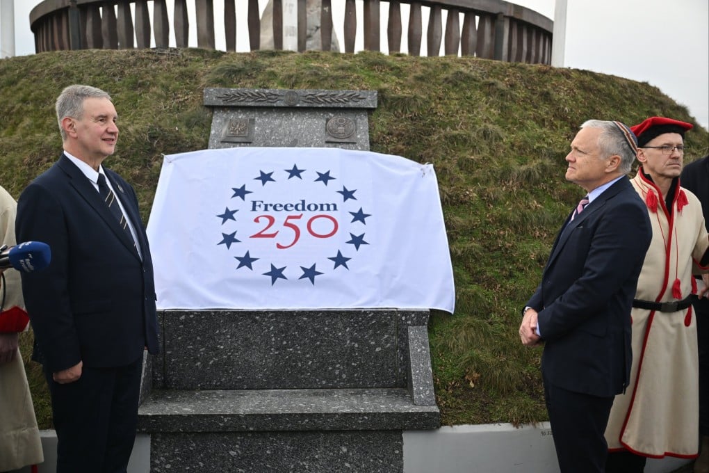 US Ambassador to Poland Thomas Rose (second right) and President of the Kosciuszko Mound Committee Piotr Dobosz (left) participate in the ceremonial unveiling of a plaque commemorating the 250th anniversary of the US Declaration of Independence on Kosciuszko Mound in Krakow, Poland, on February 12. Photo: EPA