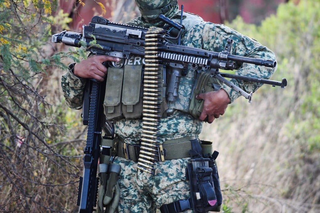 A soldier at a cordoned‑off area where federal forces carried out an operation targeting cartel boss Nemesio Oseguera Cervantes. Photo: Reuters