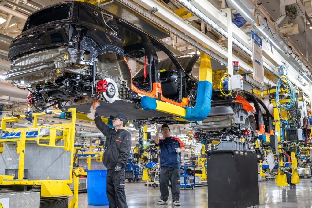 Technicians are seen working at the assembly line of Geely Auto’s Changxing plant in Huzhou, eastern Zhejiang province. Photo: VCG via Getty Images