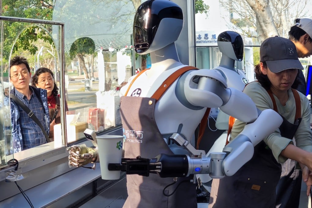 A humanoid robot prepares a drink at a coffee kiosk in Shenzhen on January 28. Photo: Getty Images