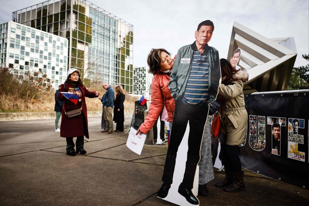 A protester holds a cut-out of Rodrigo Duterte during a demonstration in his support outside the International Criminal Court in The Hague on Monday. Photo: AFP