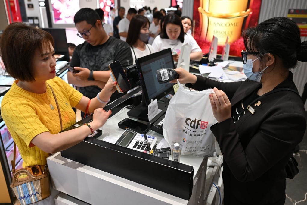 Customers check out at a duty-free store during the Spring Festival holiday in Haikou in Hainan province, as the IMF issues an urgent recommendation to China. Photo: Xinhua
