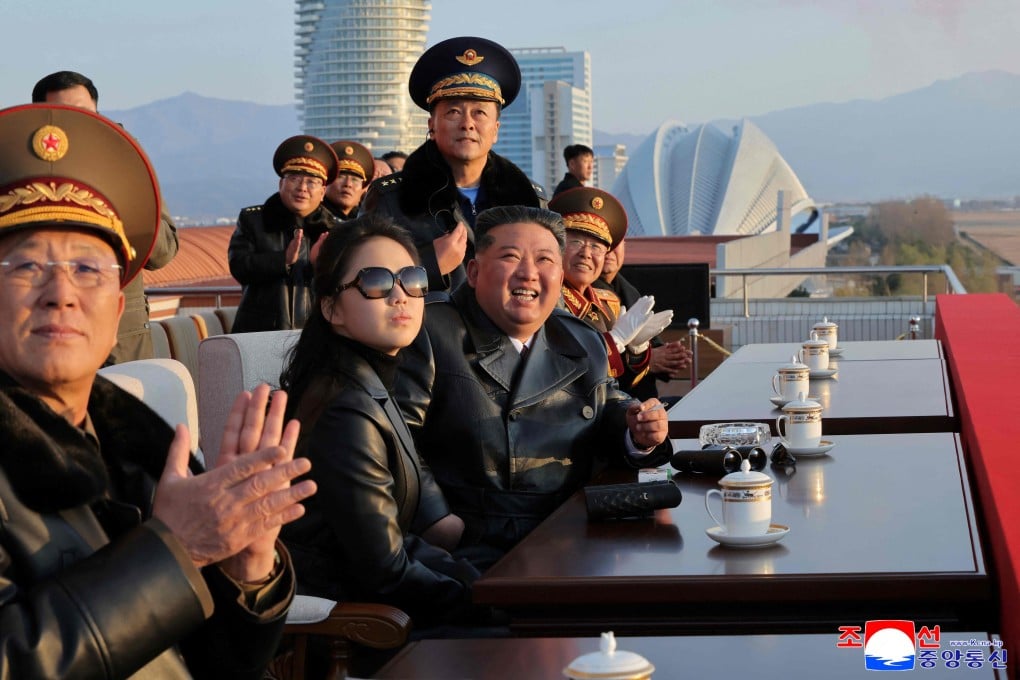 Kim Ju-ae with her father, North Korean leader Kim Jong-un, watching a demonstration flight commemorating the 80th anniversary of the founding of the Korean People’s Army Air Force at Kalma Airfield in Wonsan, Gangwon province, on November 28. Photo: KCNA via KNS/AFP