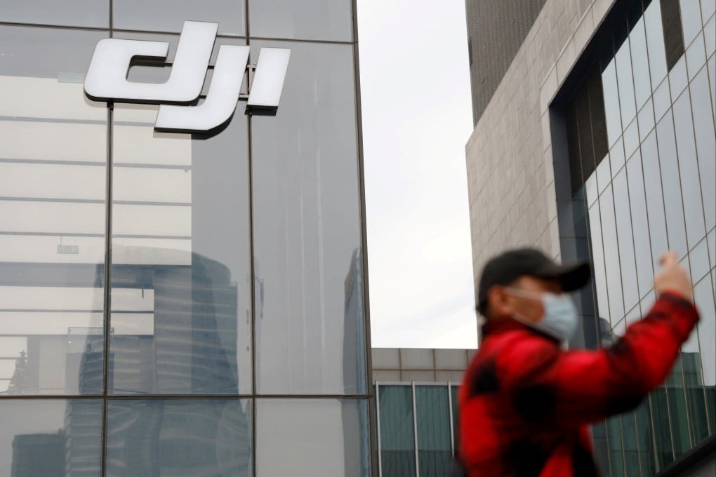 A man stands outside a DJI store in Beijing in December 2021. Photo: Reuters