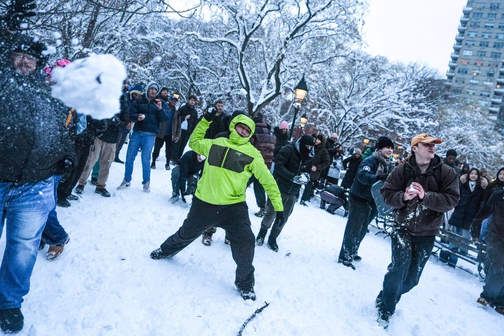 An organised snowball fight takes place in Washington Square Park in New York on Monday. Photo: AFPP)