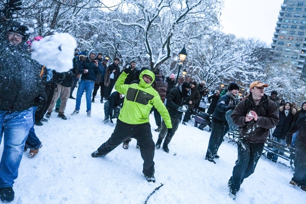 An organised snowball fight takes place in Washington Square Park in New York on Monday. Photo: AFPP)