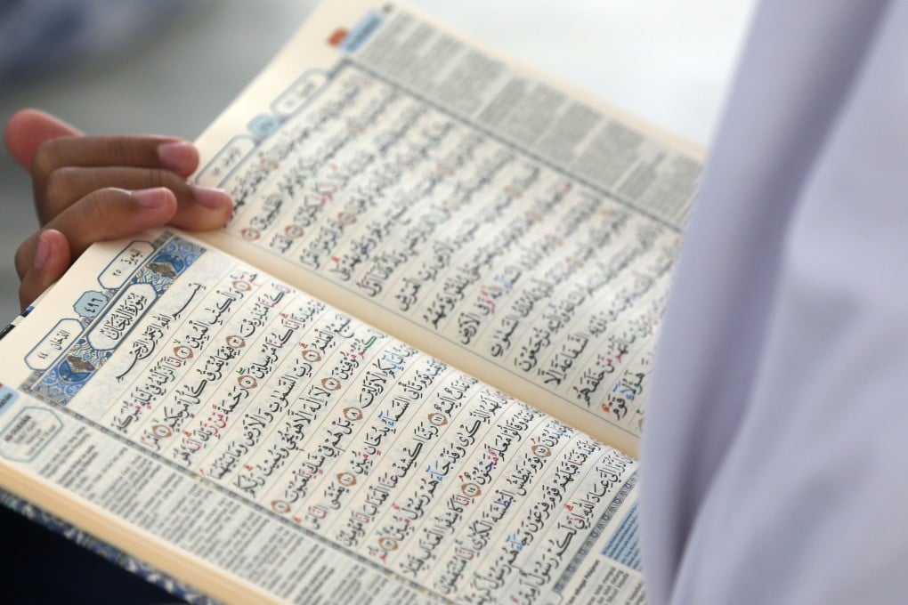 Students learn to read the Koran as part of Ramadan activities in Banda Aceh, Indonesia, on Wednesday. Photo: EPA