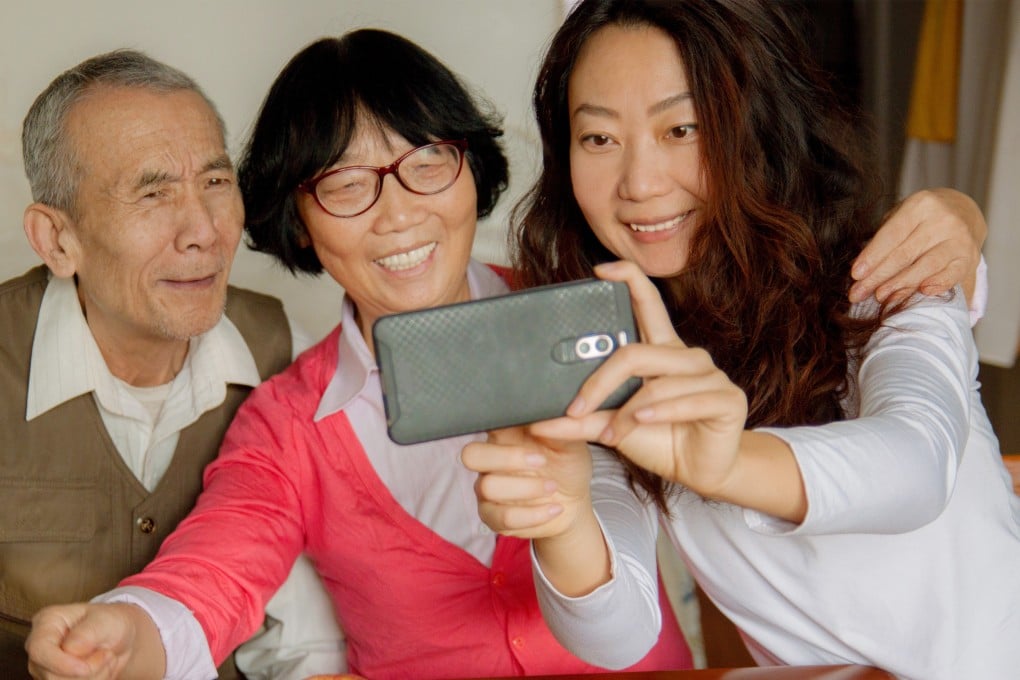 A “parenting parents” trend has become popular among young Chinese people, who share experiences teaching their parents modern skills like taking selfies and applying skincare products. Photo: Shutterstock