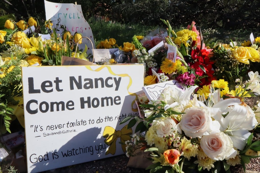 A memorial grows outside the home of Nancy Guthrie, the missing mother of “Today” show host Savannah Guthrie, on Sunday. Photo: AP