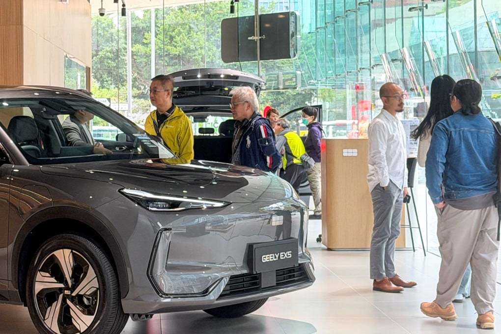 Customers at a Geely electric vehicle showroom in Kowloon Bay. Photo: Jelly Tse