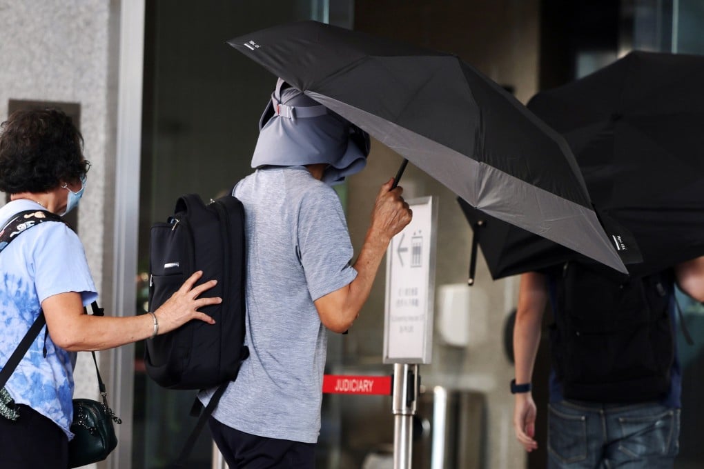 Kwok Yin-sang (centre), the father of US-based activist Anna Kwok, was jailed for eight months. Photo: Edmond So