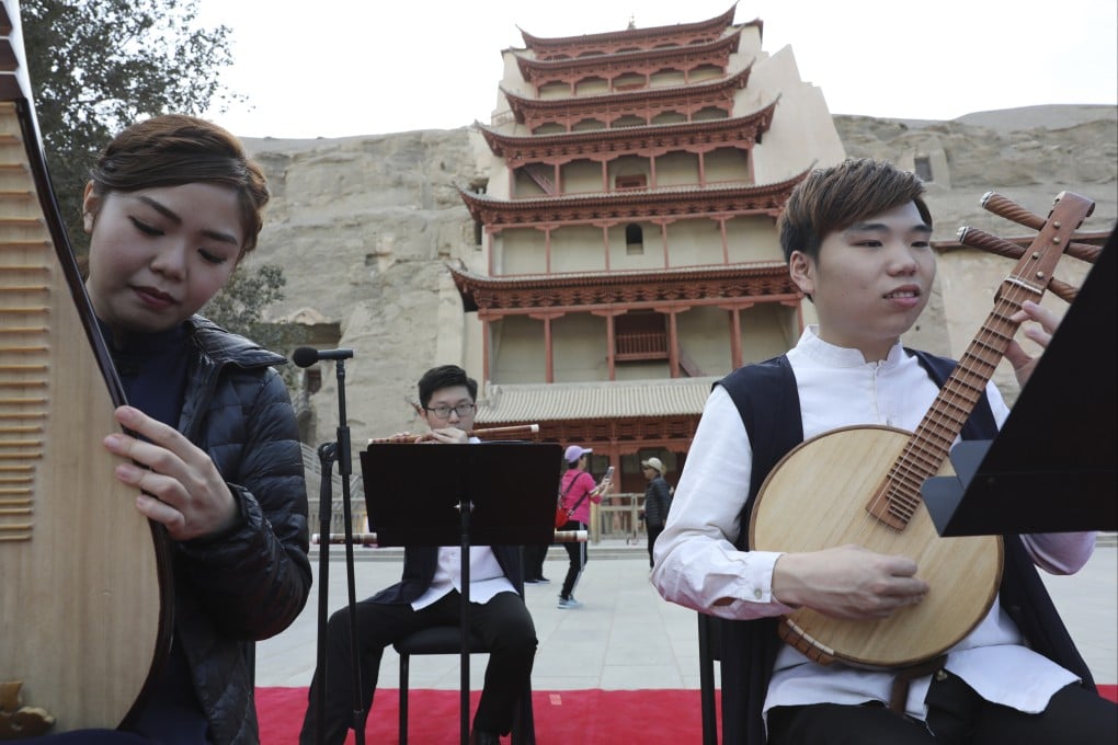 Musicians from the Hong Kong Gaudeamus Dunhuang Ensemble perform in front of the Nine-Storey Pagoda at the Mogao Caves at Dunhuang, in northwest China’s Gansu province. Photo: Simon Song