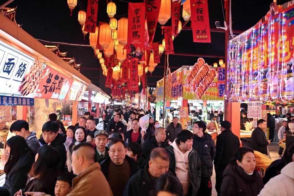 Crowds of tourists walk down a commercial street in a county in China’s central Hubei province during the Chinese New Year holiday. Photo: Xinhua