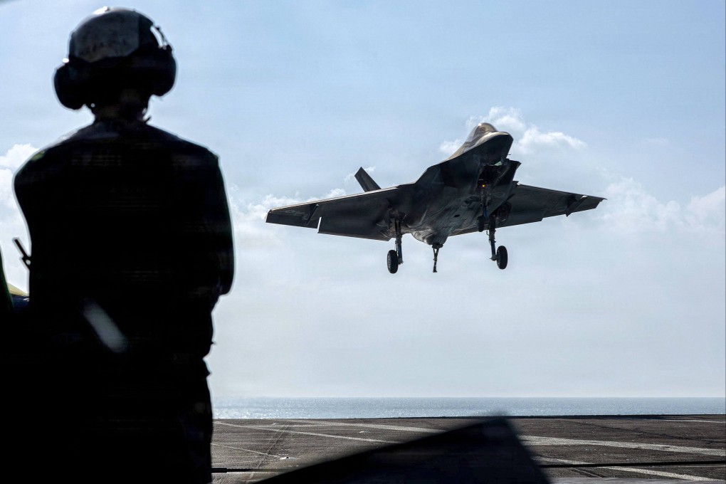 A US Air Force F-35C Lightning II lands on the flight deck of the USS Abraham Lincoln in the Arabian Sea on February 12. Photo: AFP