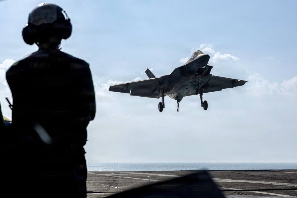 A US Air Force F-35C Lightning II lands on the flight deck of the USS Abraham Lincoln in the Arabian Sea on February 12. Photo: AFP