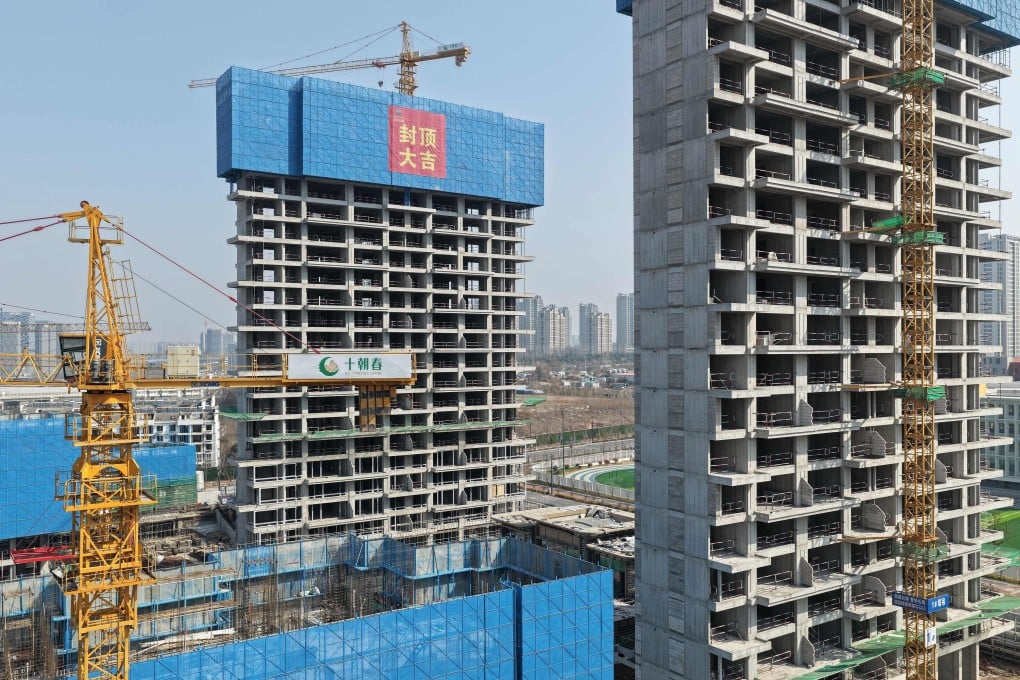 Blocks of flats under construction in Nanjing, Jiangsu province, on February 13. A prolonged property slump has dented the confidence of China’s private sector. Photo: AFP