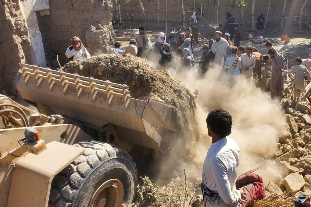 Machinery clears the debris of a damaged house after Pakistani air strikes in Nangarhar, Afghanistan, on Sunday. Photo: Reuters