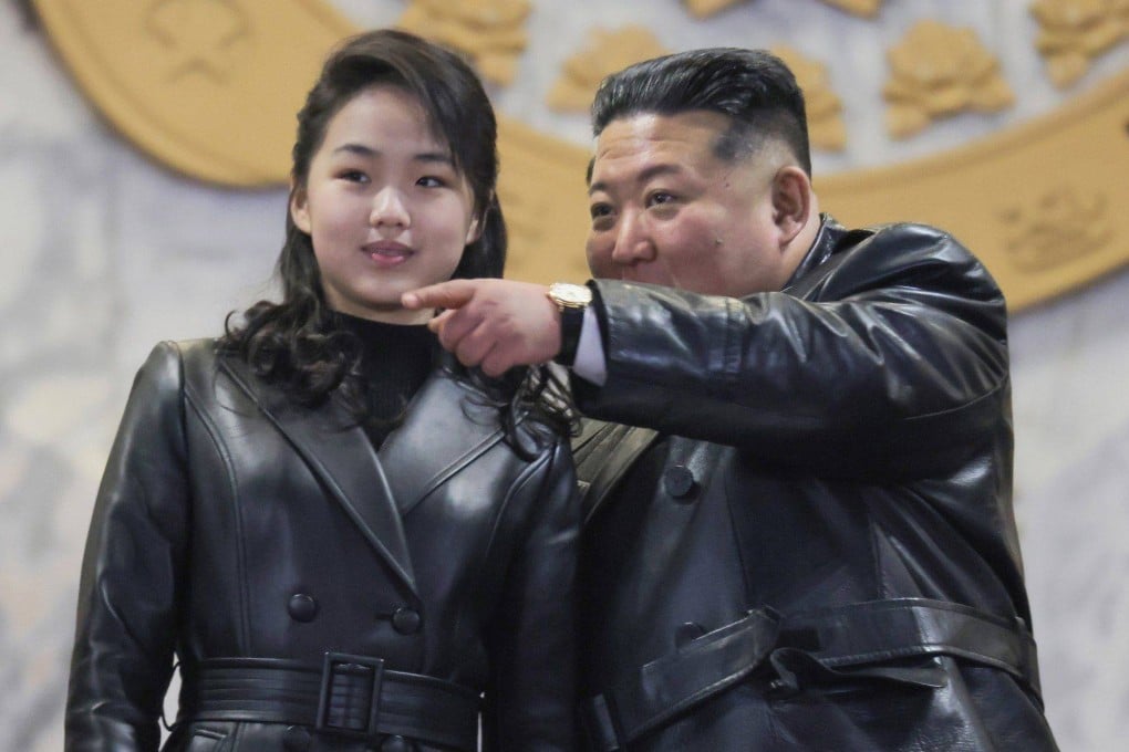 North Korean leader Kim Jong-un and his daughter, Ju-ae, attend a military parade at Kim Il-sung Square in Pyongyang, to mark the ninth congress of the ruling Workers’ Party. Photo: KCNA/YNA/dpa
