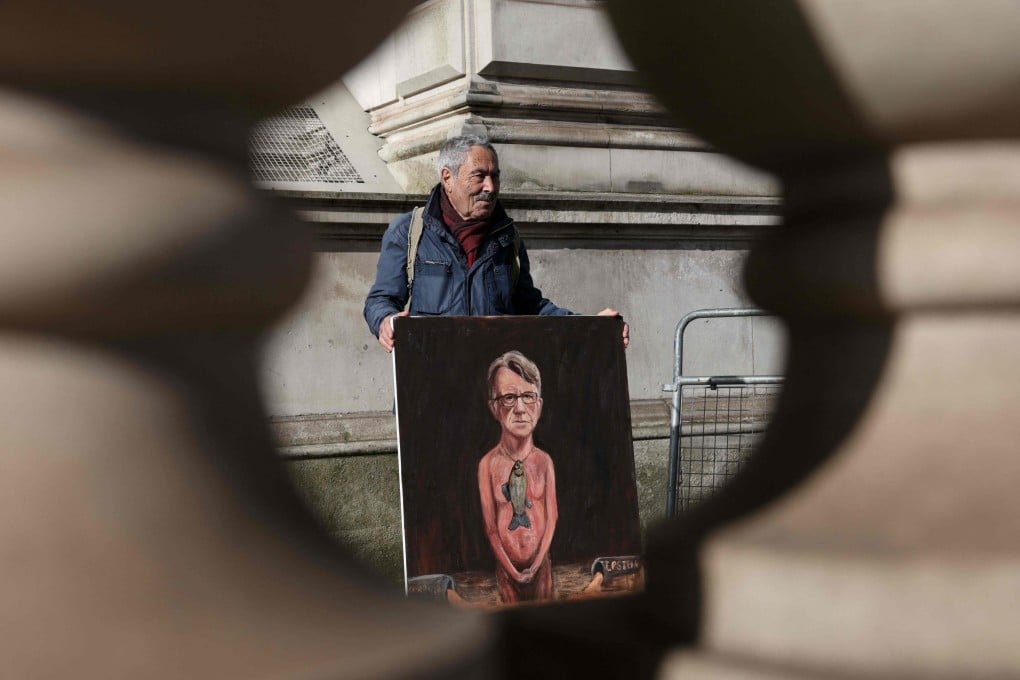 Artist Kaya Mar displays a painting of Britain’s former ambassador to the US, Peter Mandelson, outside Downing Street in central London on Wednesday. Photo: AFP
