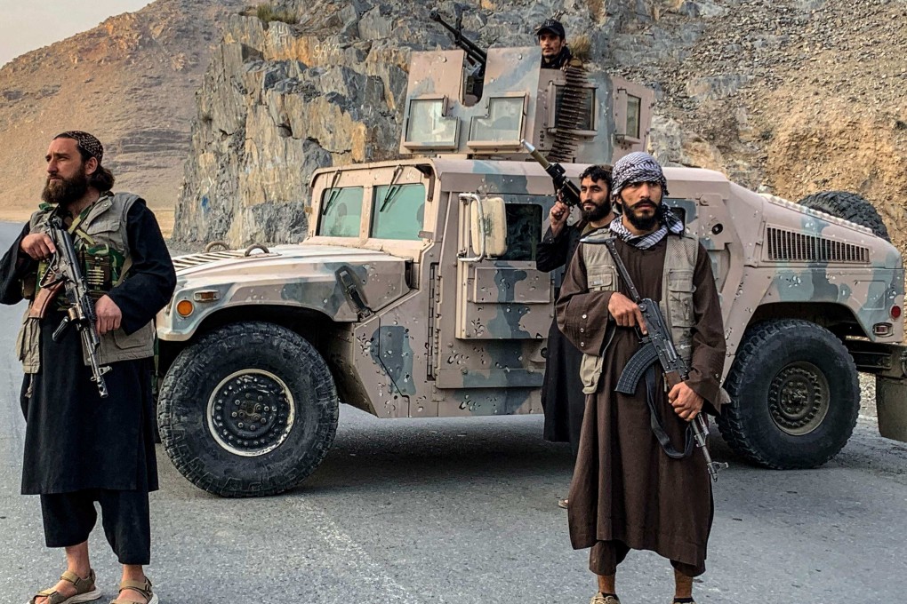Taliban security personnel stand guard near the Torkham border crossing between Afghanistan and Pakistan on Friday. Photo: AFP