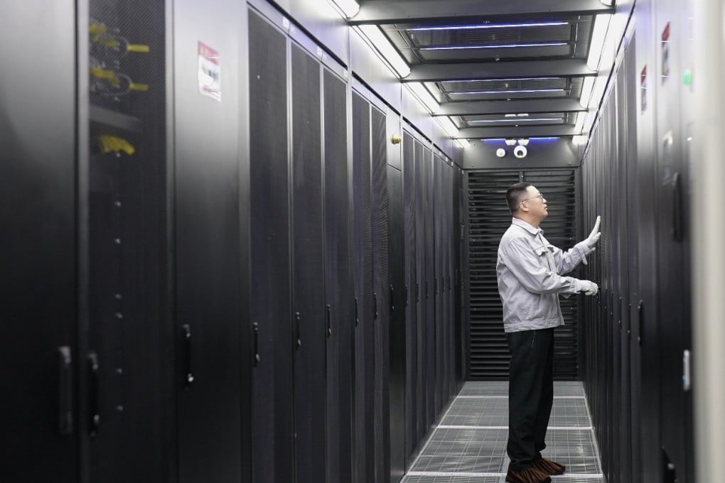 An employee conducts maintenance at a data centre in China’s northern Inner Mongolia region. Massive investment in artificial intelligence data centres has contributed to a rapid build-up in global debt levels over the past year, according to a new report. Photo: Xinhua
