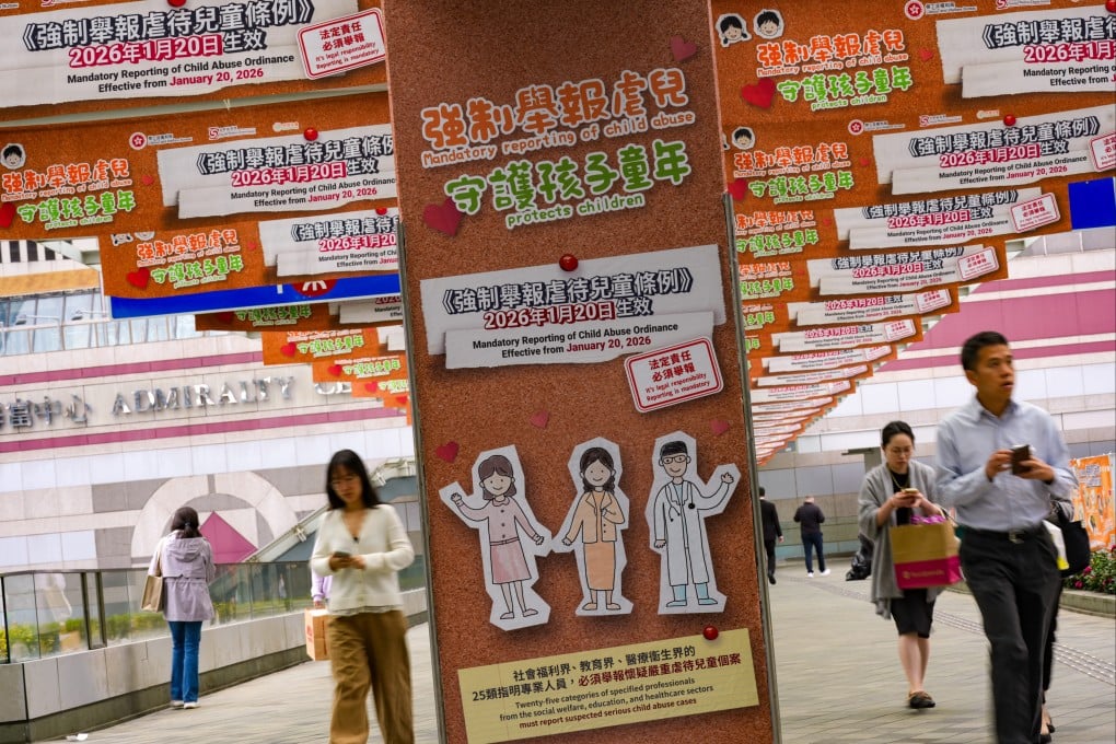 Posters promote the Mandatory Reporting of Child Abuse Ordinance along a footbridge in Admiralty on January 20. Photo: Jelly Tse