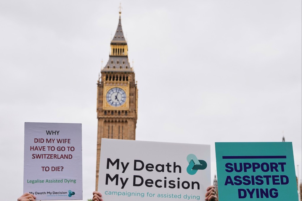 Pro-assisted dying campaigners holding banners in London last year. Photo: AP