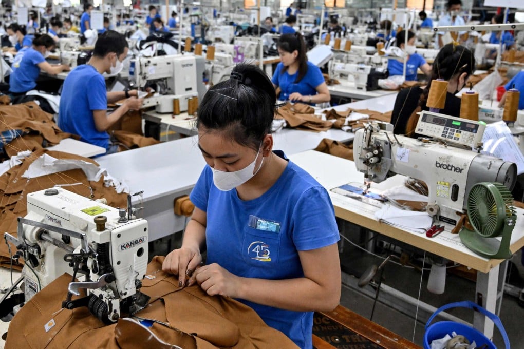 Vietnamese workers stitch apparel at a garment factory in Thai Nguyen province on July 2, 2025. Photo: AFP