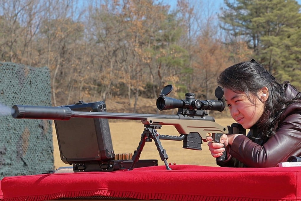 North Korean leader Kim Jong- un’s daughter, believed to be called Kim Ju-ae, firing a sniper rifle at a shooting range in North Korea on Friday. Photo: North Korean Central News Agency via EPA