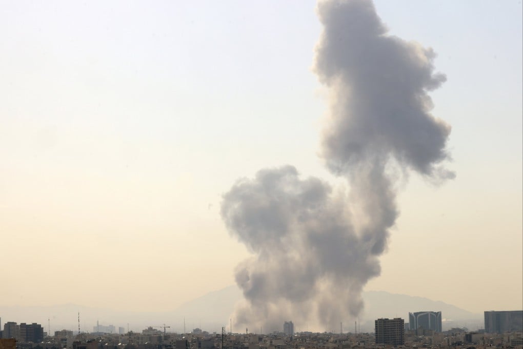 Smoke rises in central Tehran after Israel launched what it called a pre-emptive strike on Saturday. Photo: EPA