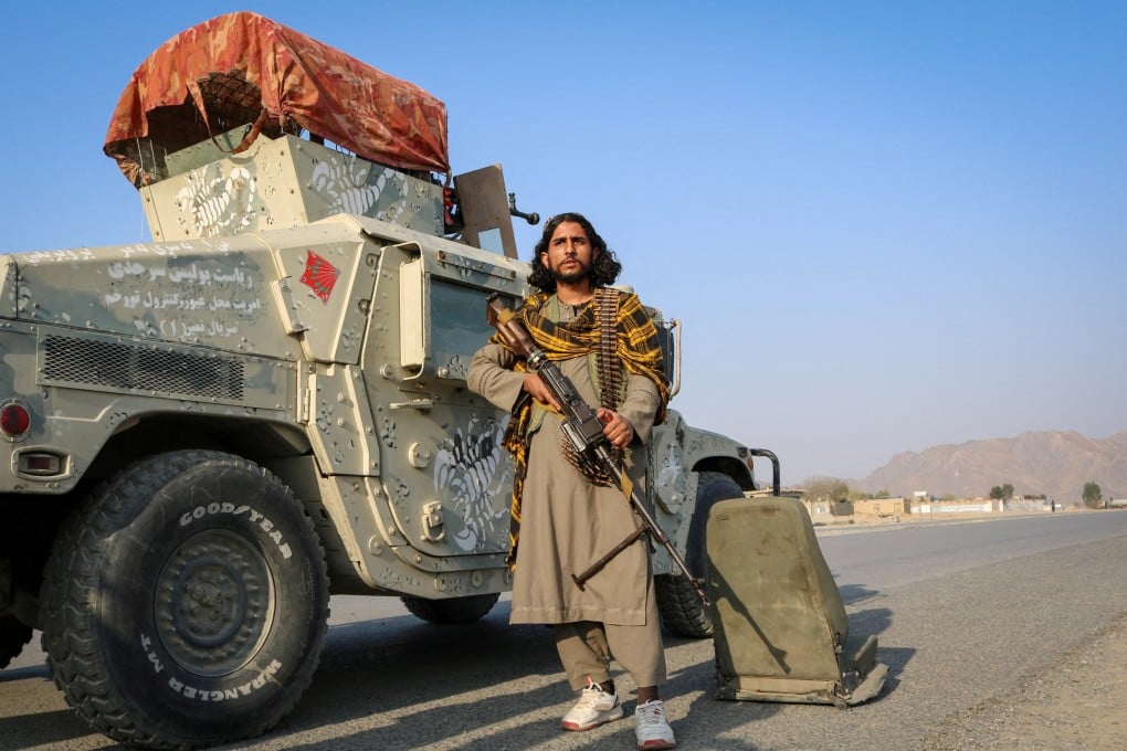 A Taliban fighter holds his weapon beside a Humvee after exchanges of fire between Pakistani and Afghan forces in Momand Dara district of Nangarhar province, Afghanistan, on Saturday. Photo: Reuters