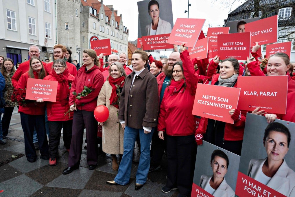 Denmark’s Prime Minister Mette Frederiksen (centre) campaigns at Nytorv in Aalborg on Friday ahead of the country’s March 24 general election. Photo: AFP