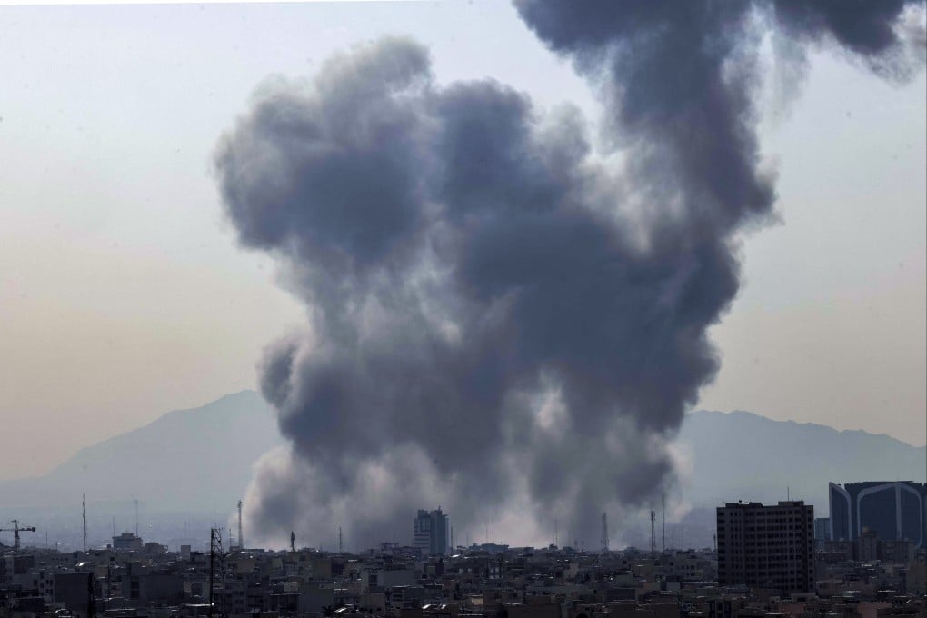 A plume of smoke rises following a reported explosion in Tehran on Saturday. Photo: AFP