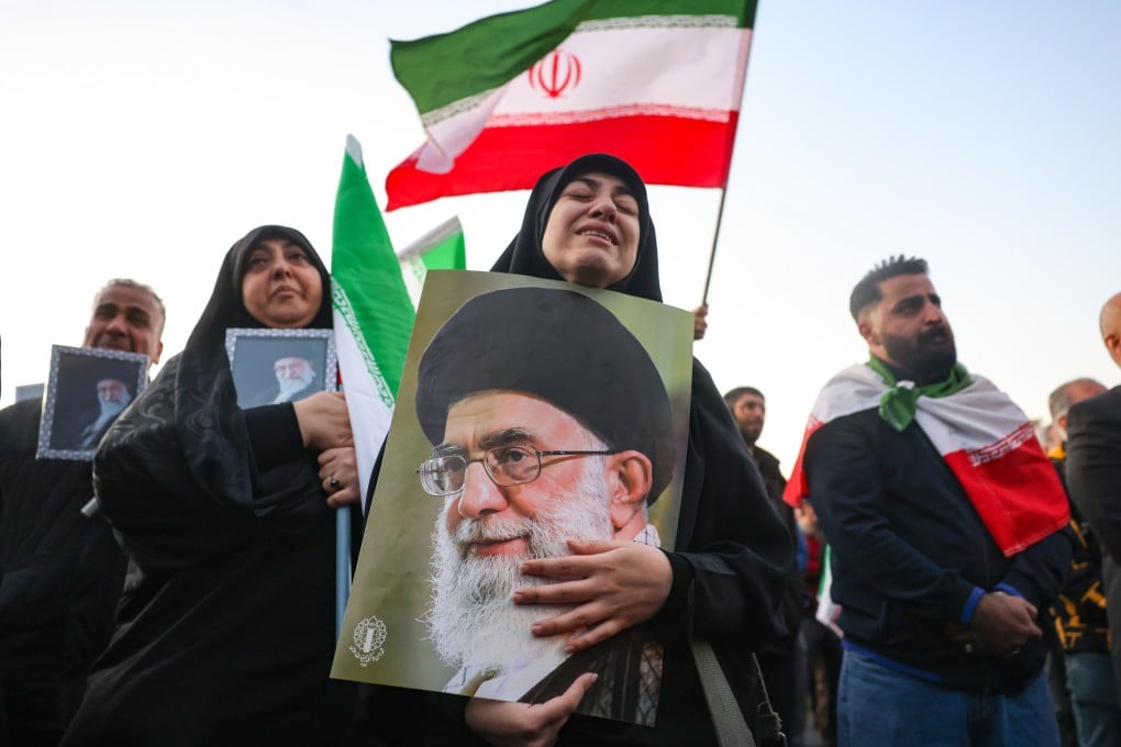 Mourners hold pictures of Ayatollah Ali Khamenei, the Iranian supreme leader killed in US-Israeli air strikes, in Tehran on Sunday. Photo: EPA
