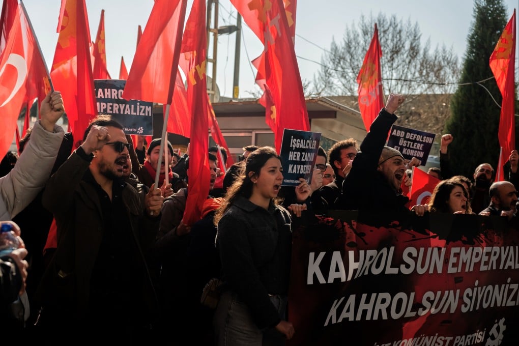People chant slogans as they protest against US and Israeli strikes on Iran, outside a Nato base in Izmir, Turkey, on Saturday. Photo: AP