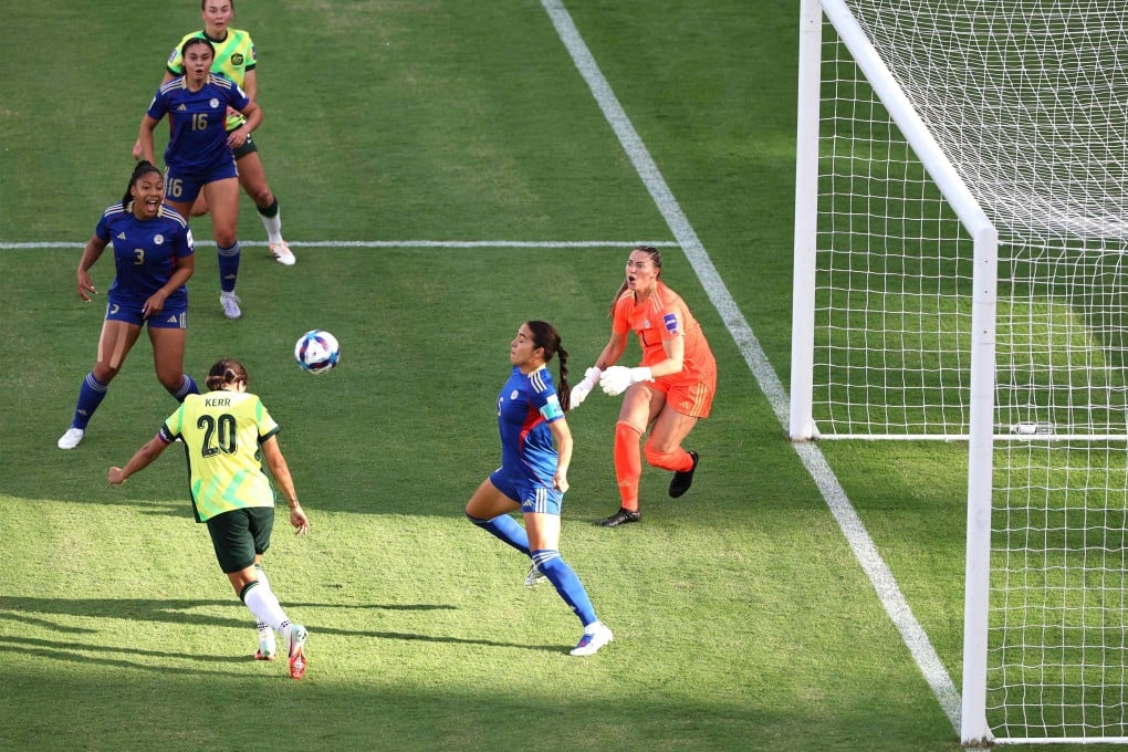 Sam Kerr (left) heads the only goal in Australia’s 1-0 win over the Philippines in the opening game of the AFC Womens Asian Cup at Perth Stadium on Sunday. Photo: AFP