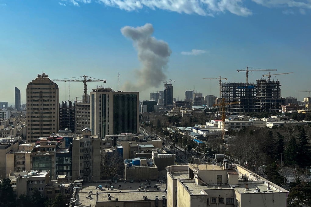 A plume of smoke rises following an explosion in Tehran, Iran, on Saturday. Photo: AFP via Getty Images/TNS