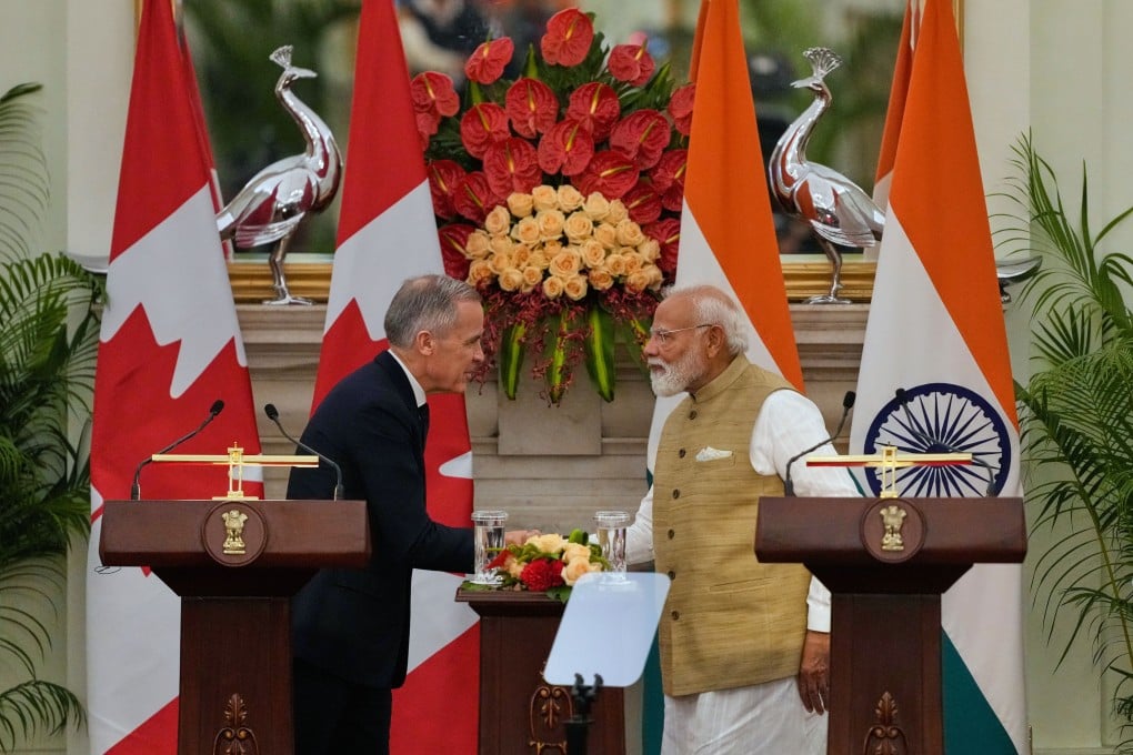 India Prime Minister Narendra Modi, right, shakes hands with his Canadian counterpart Mark Carney in New Delhi on Monday. Photo: AP