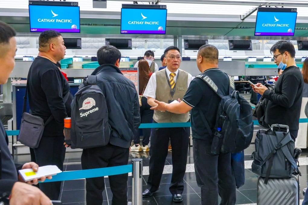 Passengers affected by flight disruptions queue at Hong Kong airport. Photo: Dickson Lee
