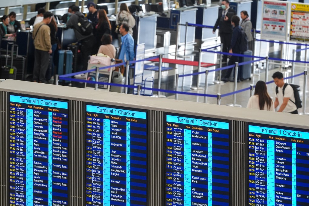 Travellers at Hong Kong International Airport. Analysts predict airline ticket prices will rise as carriers seek to offset higher expenses.   Photo: Eugene Lee