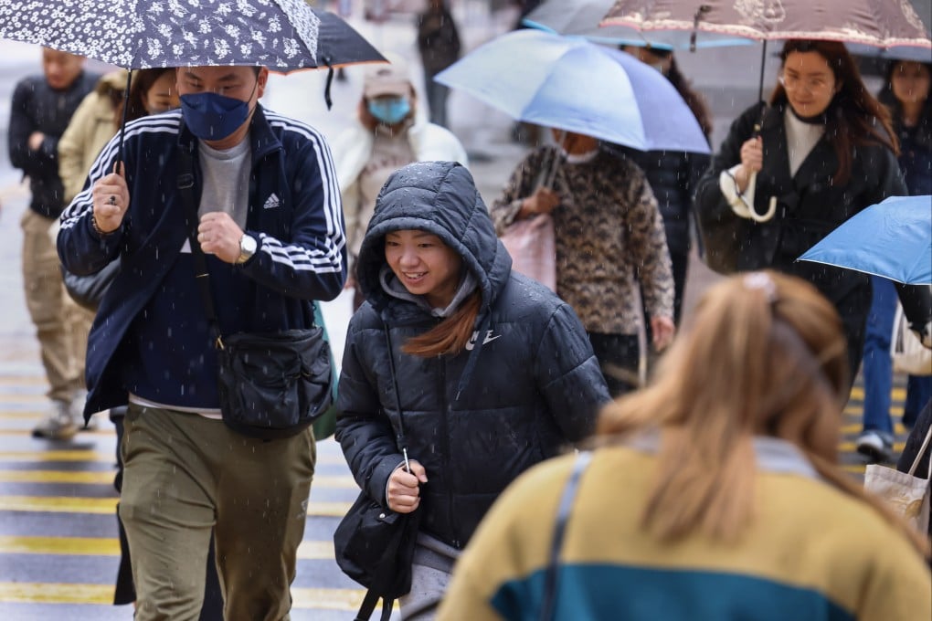 People in Mong Kok navigating the rainy weather in March 2025. Photo: Dickson Lee
