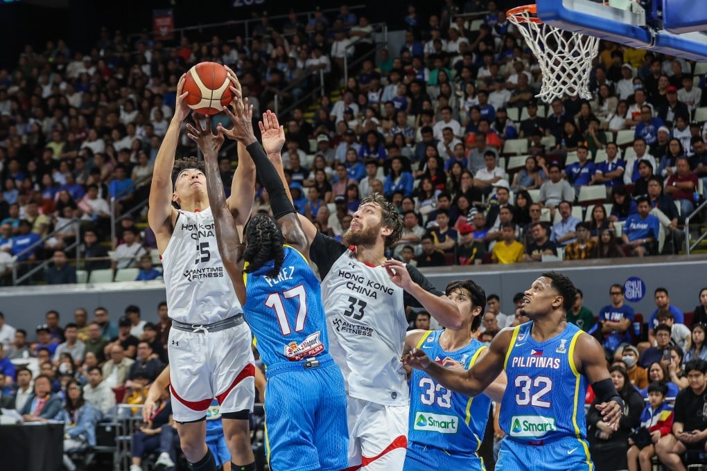 Hong Kong’s Yiu-Pong YIP (left) and Duncan Reid (centre) battle for the ball with the Philippines’ CJ Perez during a 2025 Asia Cup qualifier. Photo: Xinhua