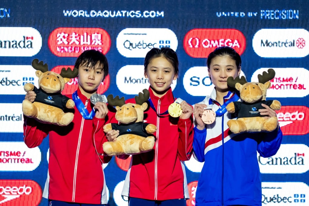 Gold medalist Jiang Linjing (centre) alongside teammate Cui Jiaxi (left) and bronze medalist Jin Jo Mi of North Korea. Photo: AP