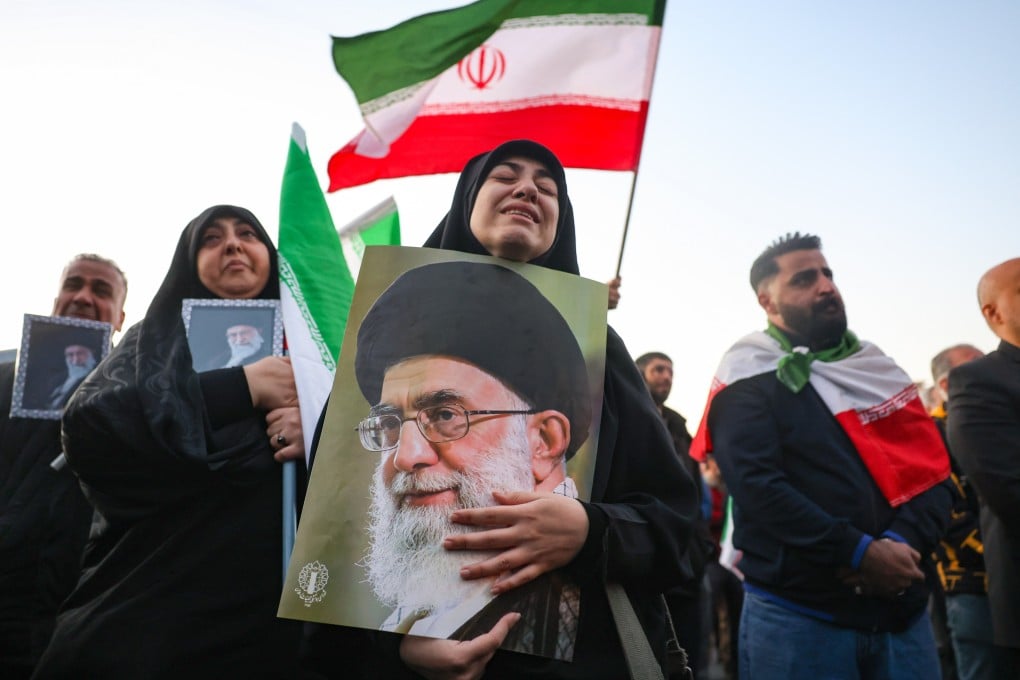 Mourners hold pictures of Ayatollah Ali Khamenei, the Iranian supreme leader killed in US-Israeli air strikes, in Tehran on Sunday. Photo: EPA