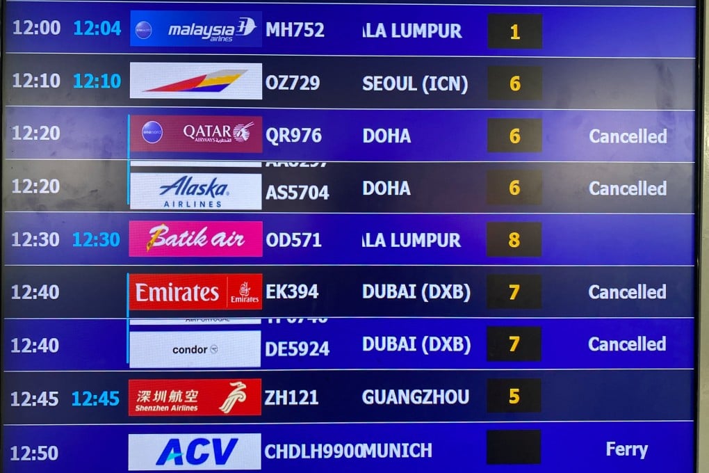 A display board at Noi Bai International Airport in Hanoi shows cancelled flights to Dubai and Doha on Monday, amid the US-Israel conflict with Iran. Photo: Reuters