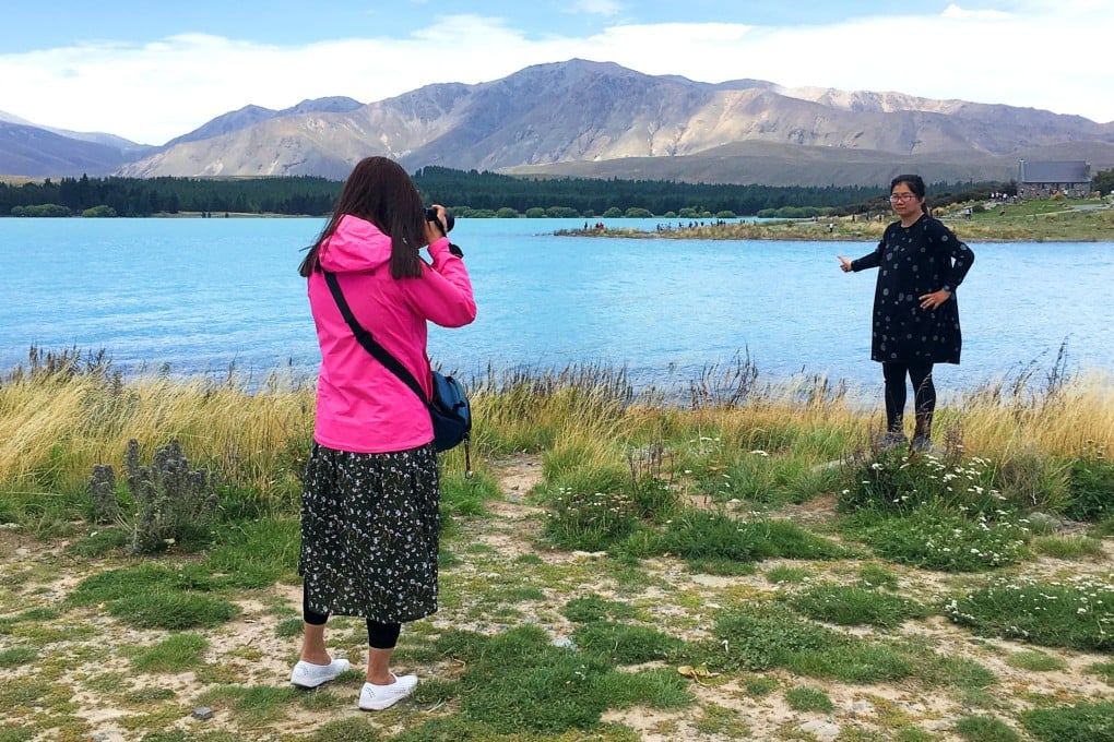 Chinese tourists take photos at Lake Tekapo in New Zealand’s South Island. Photo: SCMP